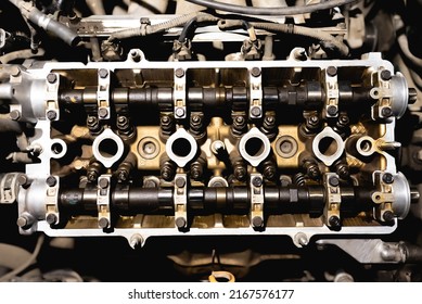 Disassembled car engine. Cylinder head of an automobile engine. Repaired car inside. Sixteen valves. Car service. View from above - Powered by Shutterstock