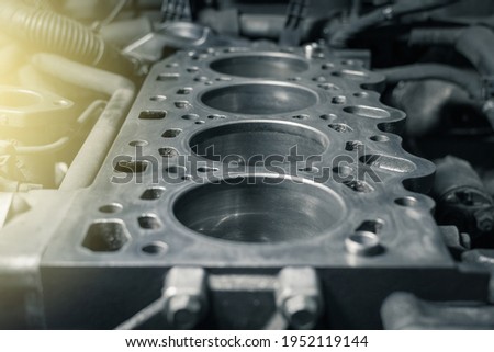 Disassembled car engine without cylinder head. Repair of an old turbocharged diesel engine in a car workshop. Close up.