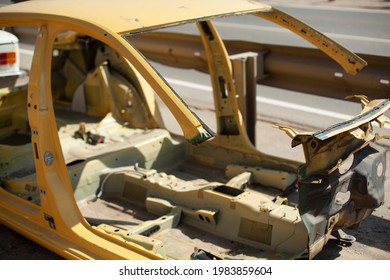 Disassembled Car Frame On The Street. Car After An Accident. Unsuitable Vehicle For Use. Damaged Machine Frame.