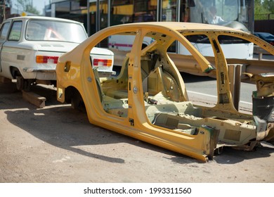 Disassembled Car Frame On The Street. Car After An Accident. Unsuitable Vehicle For Use. Damaged Machine Frame.