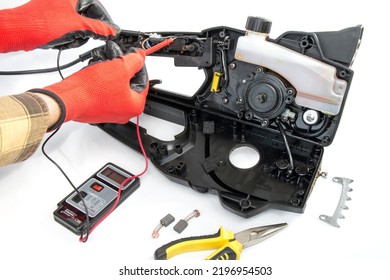 Disassembled Chain Saw, Chainsaw Repair, On A White Isolated Background