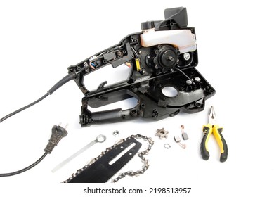 Disassembled Chain Saw, Chainsaw Repair, On A White Isolated Background