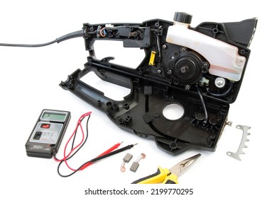 Disassembled Chain Saw, Chainsaw Repair, On A White Isolated Background