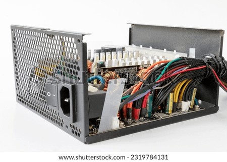 disassembled Computer Power Supply Unit, on a white isolated background