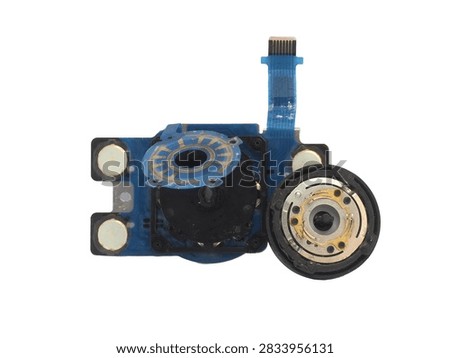 Disassembled digital camera control dial module with rotary encoder flex and tactile switch buttons, isolated on white background
