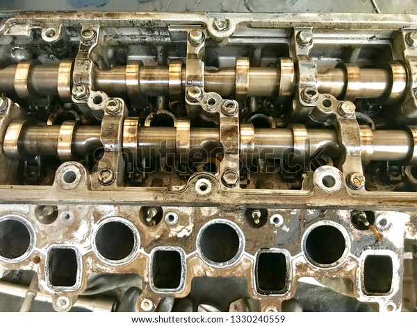 disassembled\
engine. crankshaft and gears.\
camshaft