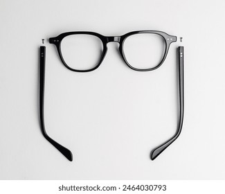 Disassembled glasses frame made of plastic material isolated on white background - Powered by Shutterstock