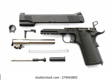 Disassembled Handgun On White Background. Seperate Parts Handgun. Pistol Part.