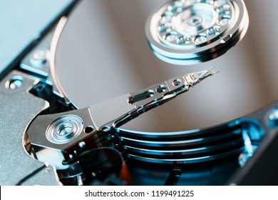 Disassembled hard drive from the computer, hdd with mirror effect. Opened hard drive from the computer hdd with mirror effects. Part of computer pc, laptop. - Shutterstock ID 1199491225