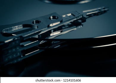 Disassembled hard drive from the computer, hdd with mirror effect. Opened hard drive from the computer hdd with mirror effects Part of computer pc, laptop Closeup SATA HDD.