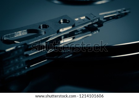 Disassembled hard drive from the computer, hdd with mirror effect. Opened hard drive from the computer hdd with mirror effects Part of computer pc, laptop Closeup SATA HDD.