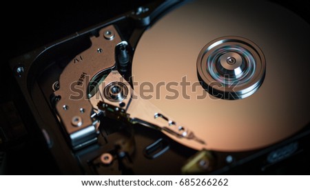 Disassembled hard drive from the computer, hdd with mirror effect Opened hard drive from the computer hdd with mirror effects Part of computer pc, laptop Closeup HDD

