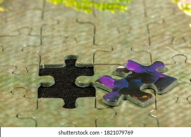 Disassembled Puzzle With A Last Wrong Piece Impossible To Fill