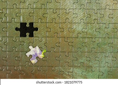 Disassembled Puzzle With A Last Wrong Piece Impossible To Fill