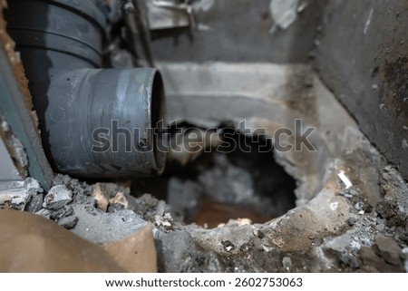 Disassembled sewer stack awaiting replacement with a new pipe.