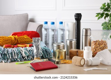 Disaster Supply Kit For Earthquake On Wooden Table At Home