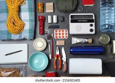 Disaster Supply Kit For Earthquake On Dark Grey Table