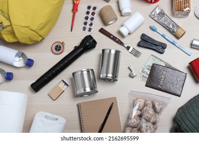 Disaster Supply Kit For Earthquake On Wooden Table, Flat Lay