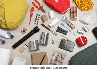 Disaster Supply Kit For Earthquake On Wooden Table, Flat Lay