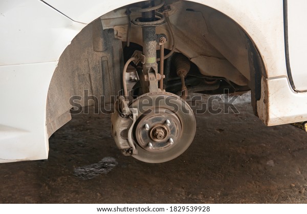 Disc\
brake of car, close-up of the front brake\
pads.