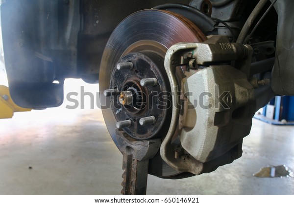 Disc brake check in\
automobile workshop