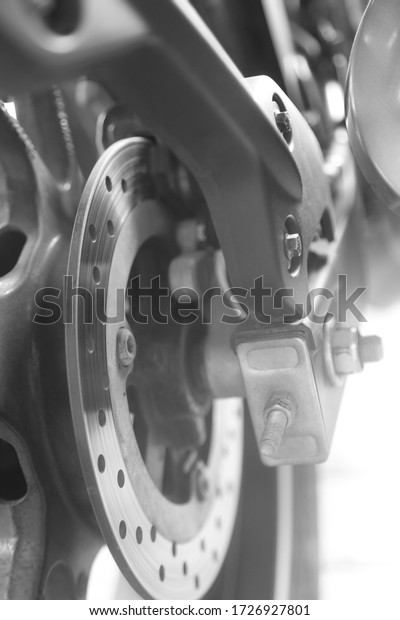 A disc brake is a type of brake that uses the\
calipers to squeeze pairs of pads against a disc or \