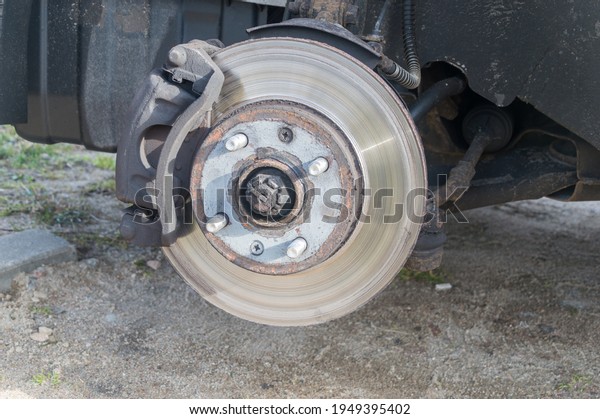 Disc brake of\
the vehicle. Car brake\
repairing.