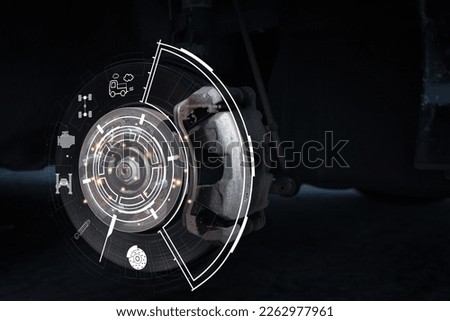 Disc brake of the vehicle for repair, in process of new tire replacement. Car brake repairing in garage.Suspension of car for maintenance brakes and shock absorber systems.Close up.
