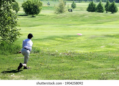 Disc Golf Player Throws On The Course