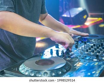 Disc Jokey Hands On A Sound Mixer Station And Vinyl In The Nightclub At A Party. Nightlife At The Club, Party Concept