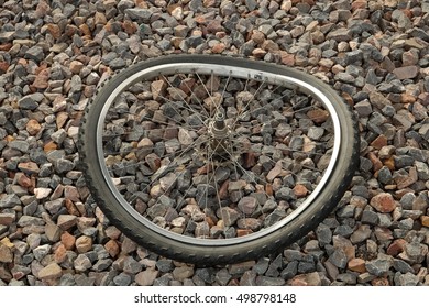 Discarded Bent Bicycle Wheel