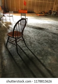 Discarded chairs in an empty space. 