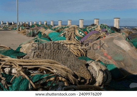Discarded Fishing Nets and Ropes at Coastal Harbor