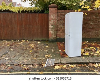 Discarded Fridge Freezer in an autumnal residential street