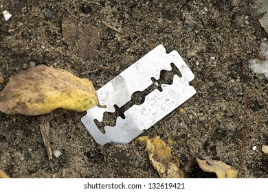 Discarded razor on the ground