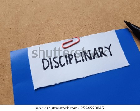 Disciplinary writting on table background.