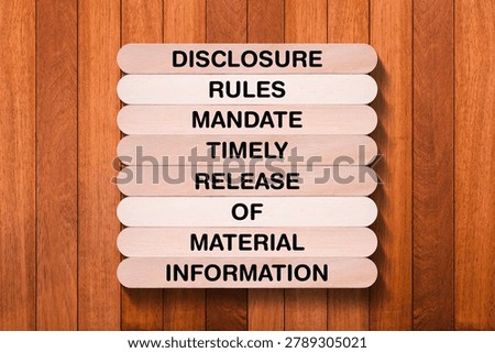 Disclosure Rules Mandate Timely Release Of Material Information tagline written on wooden stick with wooden texture background, business and investment, stock market theme, copy space