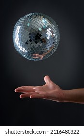 A Disco Ball Levitating Above A Man's Hand, Old School Party Concept