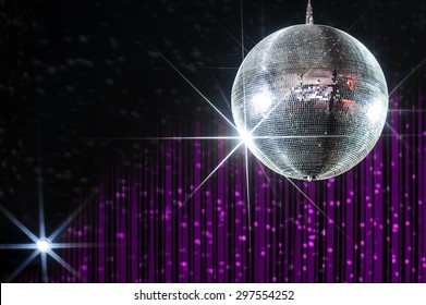 Disco ball with stars in nightclub with striped violet and black walls lit by spotlight