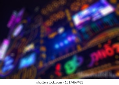 Disco Club With Neon Lights, Blurred Photo For Background. City Nightlife Concept. Tourist And Backpacker Street In Asia. Disco Bar And Nightclub Building. Neon Bar Exterior. Night Life Place