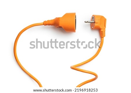 Disconnected orange electric plug and socket isolated on the white background.