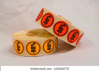 Discount Sticker Roll On Gray Background. Printed Stickers. 