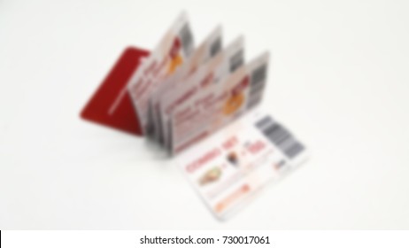 Discount Voucher. Folding Food And Beverage Voucher Discount Isolated On White Background. Free Refreshment Voucher For Company Employee Concept. Blurred Background.