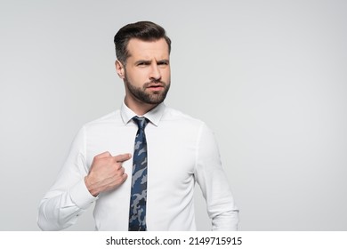 discouraged businessman pointing with finger and himself isolated on grey