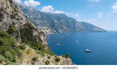 Discover the Amalfi Coast's stunning beauty, where turquoise waters meet rocky shores, dramatic cliffs, and colorful boats, all warmed by the sun's embrace. - Powered by Shutterstock