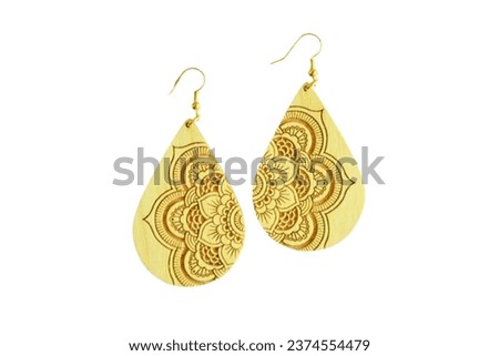 Discover the essence of rustic charm and timeless elegance with these stunning wood laser-cut earrings. Meticulously crafted with precision, each earring showcases intricate patterns that are reminisc