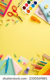 Discover the joy of education for small kids through this top view vertical image: a captivating arrangement of vibrant school supplies on a sunny yellow surface, with space for text or promotions
