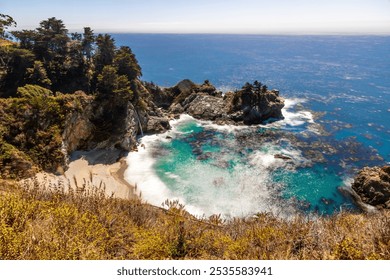 Discover McWay Falls, a stunning coastal waterfall in Big Sur, California, cascading directly into the Pacific Ocean in Julia Pfeiffer Burns State Park. - Powered by Shutterstock