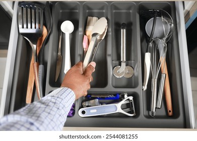 Discover an Organized Kitchen Drawer Filled with Essential Cooking Utensils and Gadgets - Powered by Shutterstock