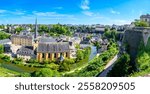 Discover the stunning view of the historic old town of Luxembourg City, known for its charming architecture and beautiful parks, making it a must-visit UNESCO World Heritage Site.